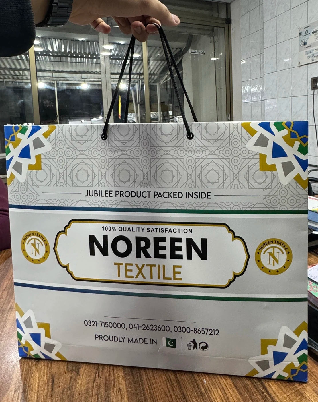 Noreen Textile branded carry bag with rope handles